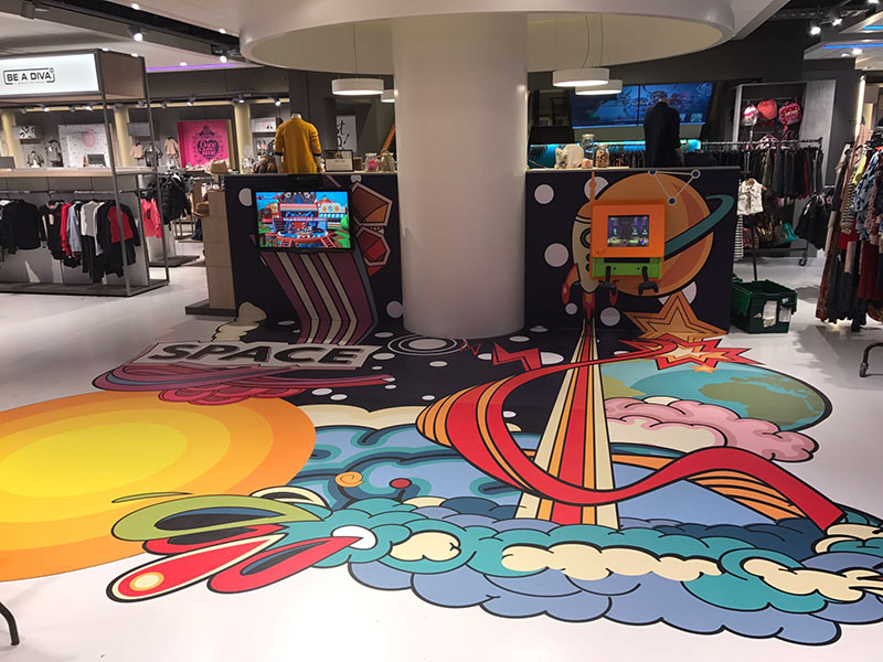 IKC space-themed play corner for children in clothing store Houtbrox in Veghel, the Netherlands