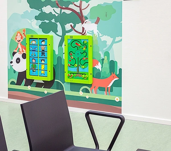 this image shows a kids corner with wall games in a hospital