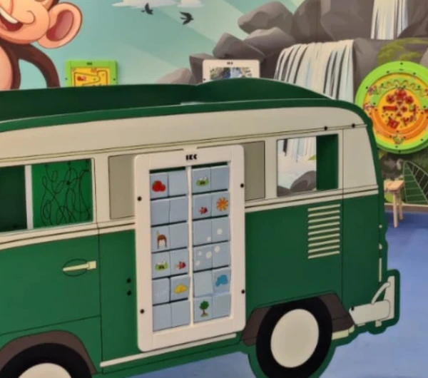 A header format photo of the kids corner at the garden centre bloemenhuis ten hove in Belguim. The photo includes the IKC van play system in the foreground as well as the various wall games on the wall in the back.