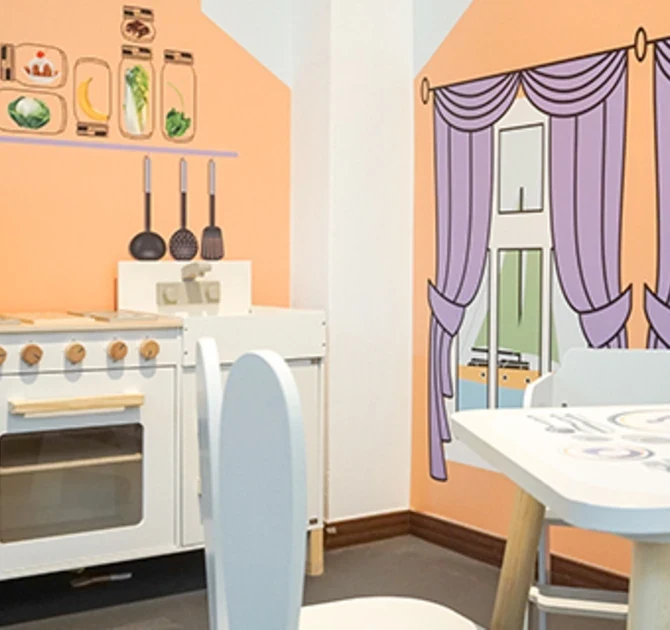 IKC speelhoek met keukentje voor kinderen in kindercafe Bude Eins in Pempelfort Duitsland